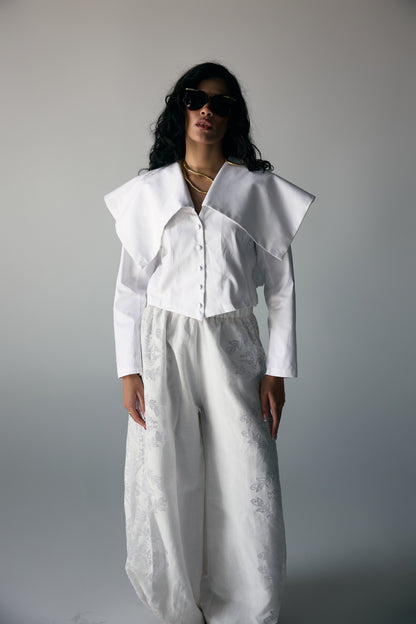 Model wearing White Origami-Collar Cropped Jacket & Jacquard Wide-Leg Trousers — view 1, Doha Zaitoon