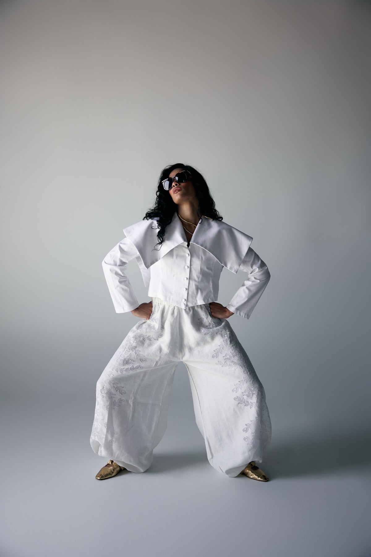 Model wearing White Origami-Collar Cropped Jacket & Jacquard Wide-Leg Trousers — view 2, Doha Zaitoon