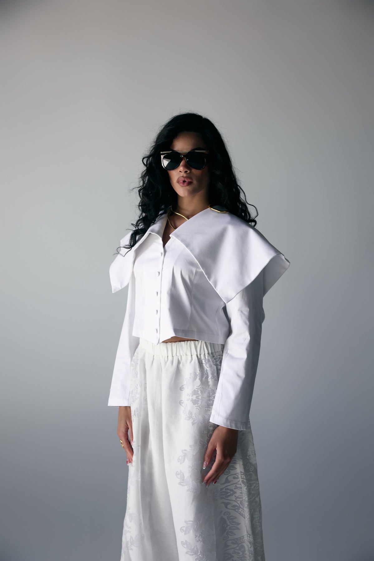 Model wearing White Origami-Collar Cropped Jacket & Jacquard Wide-Leg Trousers — view 3, Doha Zaitoon